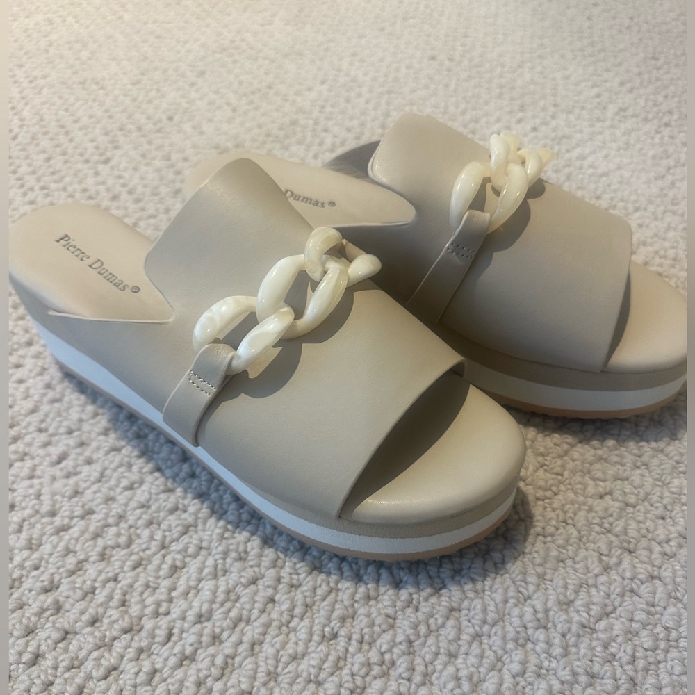 New in box. Pierre Dumas wedge sandal with bone buckle. Color Nude. Sz 8
